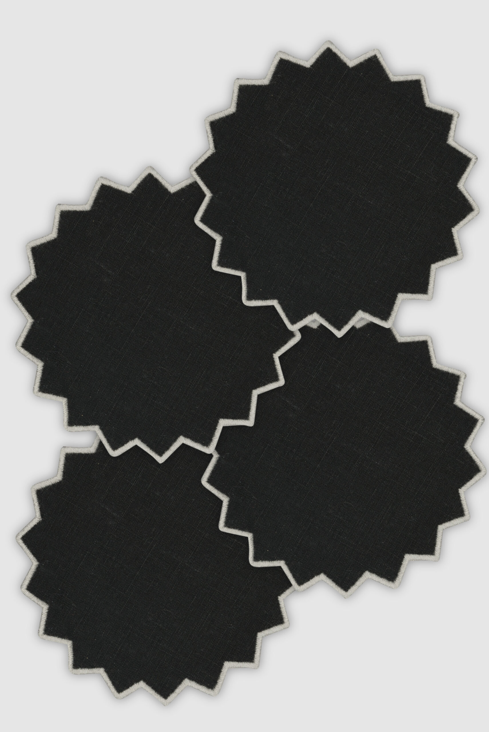 set of four triangu black/white coasters